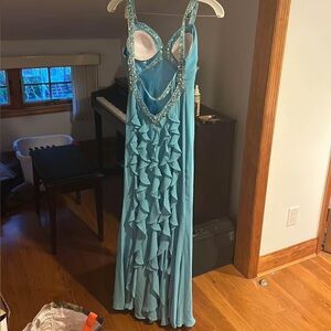 Faviana sky blue gown fitted with open back